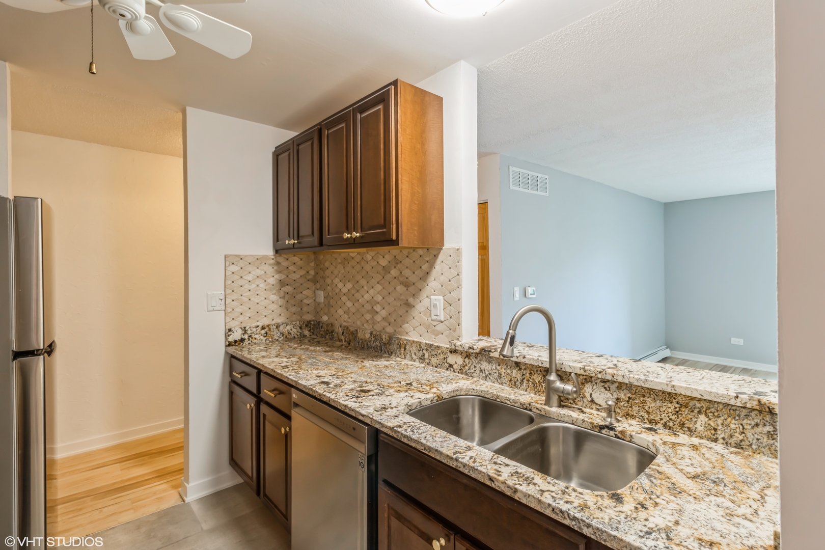 1926 Prairie Square, Unit 328 Schaumburg, IL 60173 - Photo 3 of 15 a kitchen with a sink stove and refrigerator