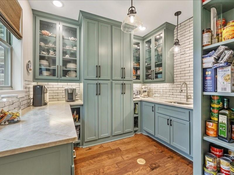 8595 Toler Pointe Larue, TX 75770 - Photo 19 of 40 10x10 Walk-in Pantry with so much storage you won't believe. All custom cabinets with pull out drawers. Sink and disposal. Coffee bar that looks out to the pines.