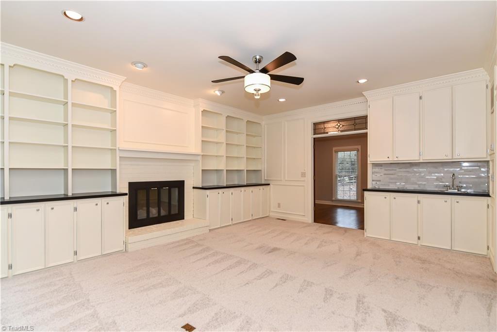 3902 Rockingham Road South Greensboro, NC 27407 - Photo 8 of 29 The den also has access to the front room and a wet bar.