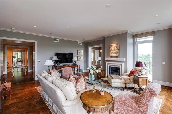 a living room with furniture fireplace and a flat screen tv
