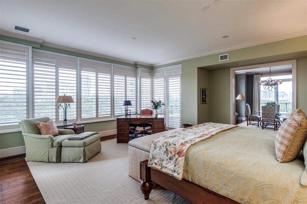 3505 Turtle Creek Boulevard, Unit 5A Dallas, TX 75219 - Photo 22 of 28 Bedroom featuring crown molding, a chandelier, and wood finished floors
