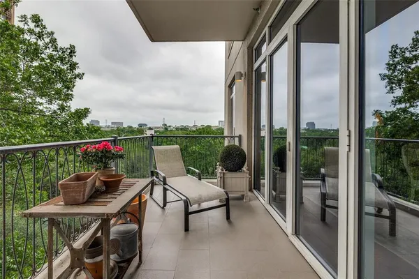 a view of a balcony with chairs