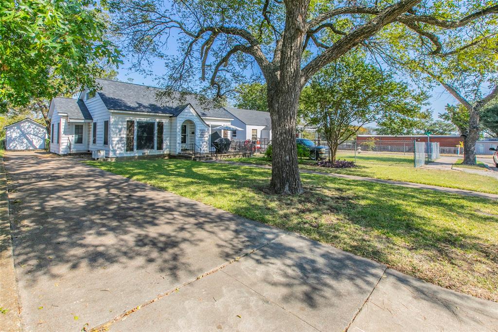 2603 Pine Avenue Waco, TX 76708 - Photo 2 of 23 a front view of a house with garden