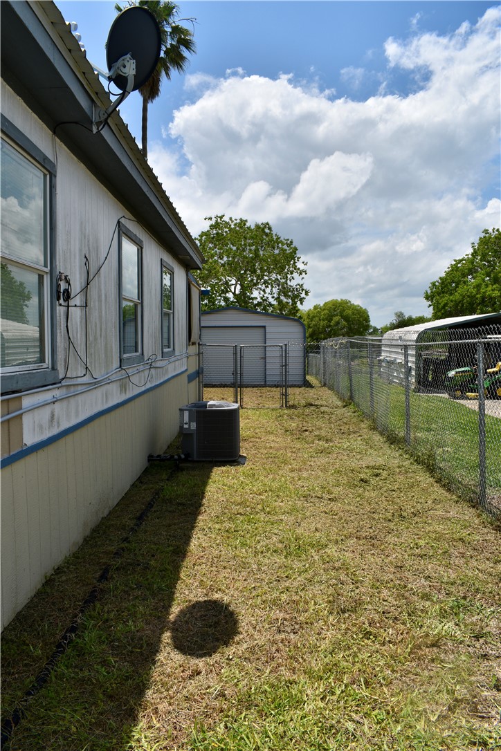 25051 Lake Shore Drive Mathis, TX 78368 - Photo 5 of 40 a view of a backyard with sitting area