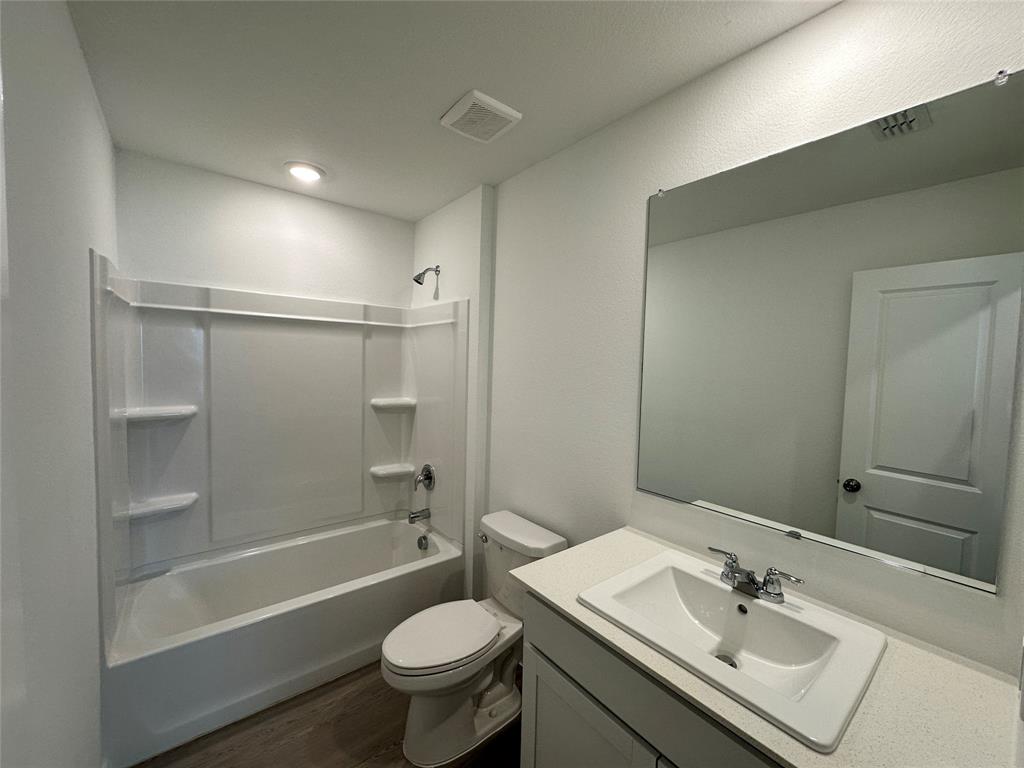 3928 Pontchartrain Parkway Sherman, TX 75090 - Photo 11 of 13 a bathroom with a sink toilet and shower