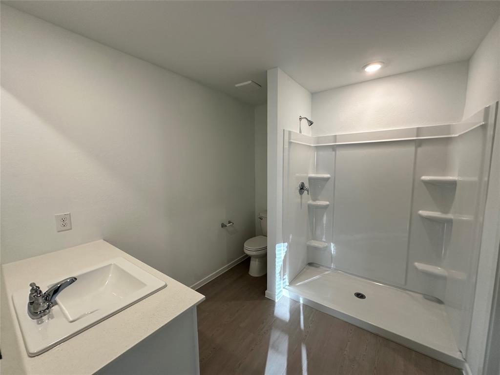 3928 Pontchartrain Parkway Sherman, TX 75090 - Photo 12 of 13 a bathroom with a shower and toilet