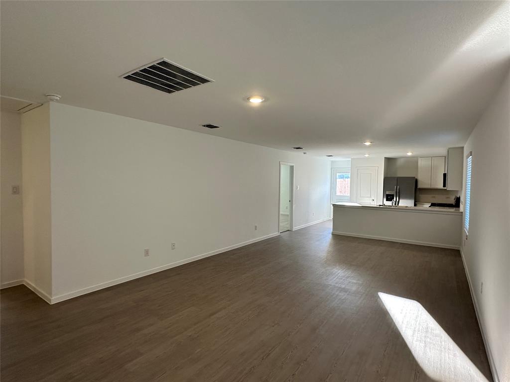 3928 Pontchartrain Parkway Sherman, TX 75090 - Photo 3 of 13 a view of a kitchen with a sink and a refrigerator