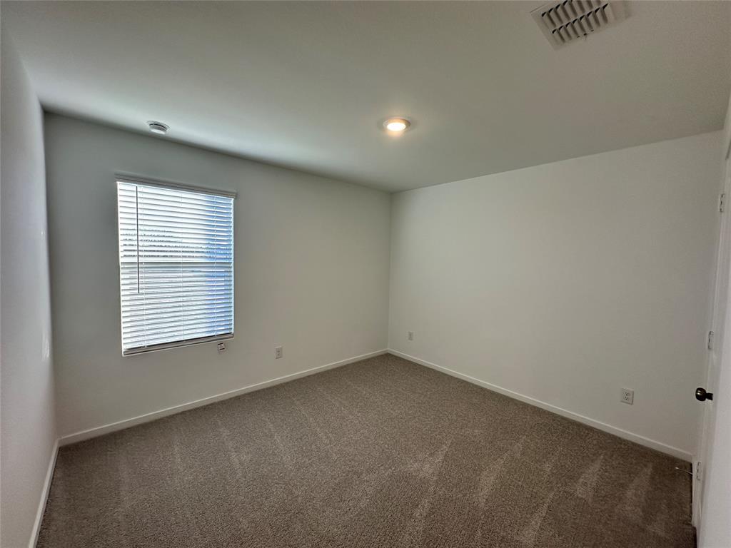 3928 Pontchartrain Parkway Sherman, TX 75090 - Photo 7 of 13 an empty room with a window