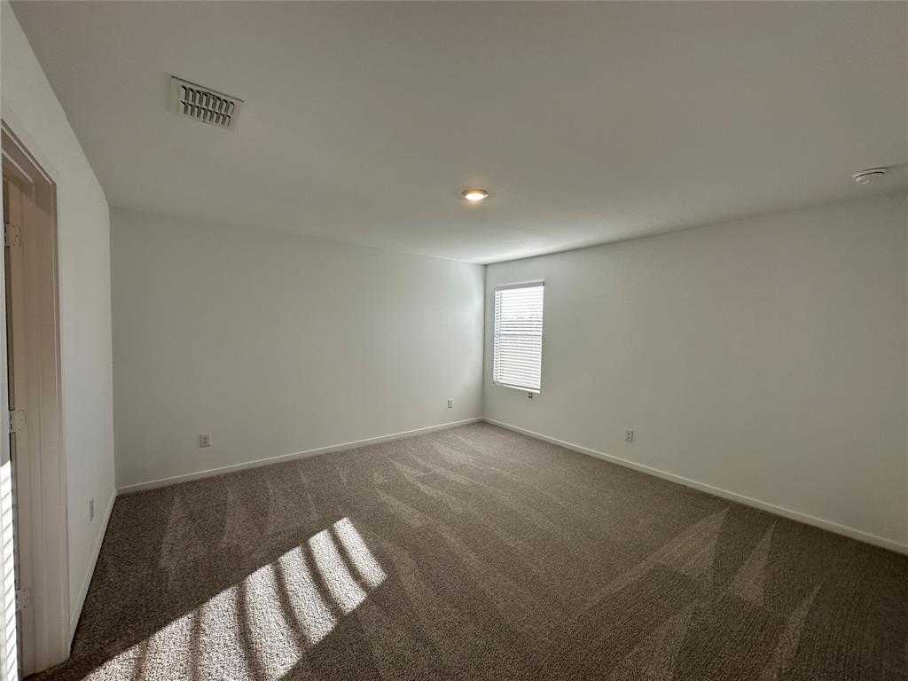 3928 Pontchartrain Parkway Sherman, TX 75090 - Photo 9 of 13 an empty room with windows