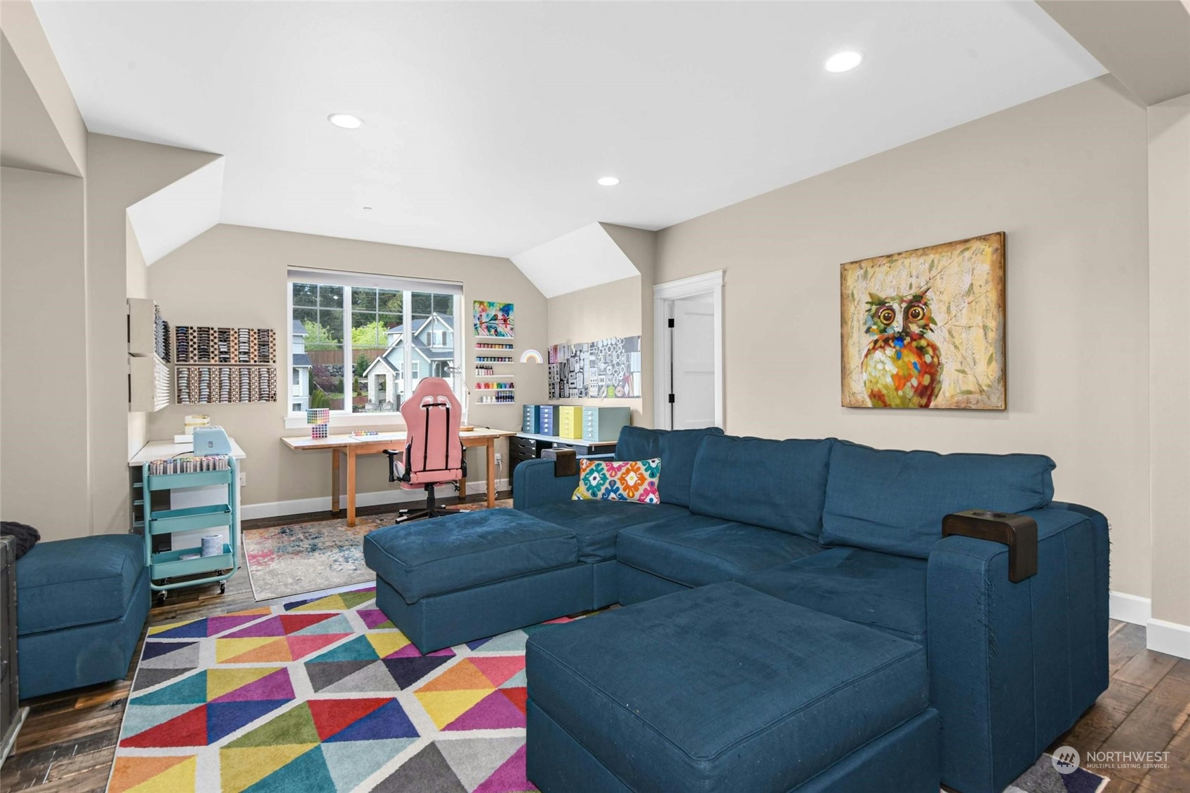 23815 3rd Drive Southeast Bothell, WA 98021 - Photo 23 of 37 a living room with furniture and a baby crib next to a window