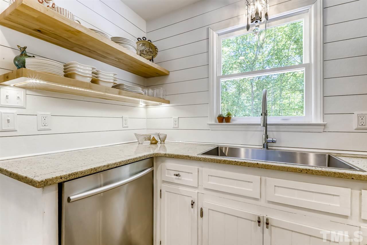 3501 Campbell Road Raleigh, NC 27606 - Photo 14 of 30 New floating shelves, new faucet and new sink. Beautiful new lighting throughout the home!