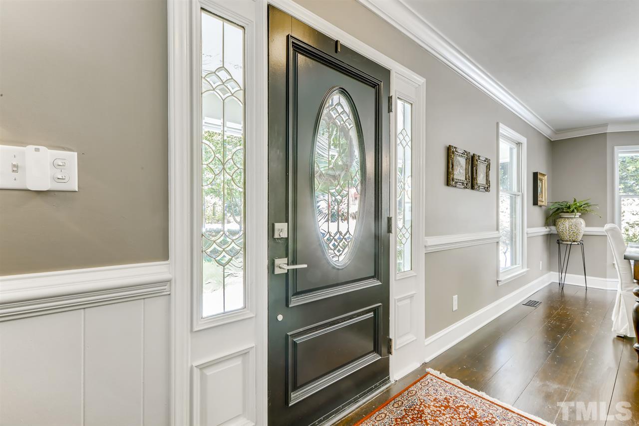 3501 Campbell Road Raleigh, NC 27606 - Photo 6 of 30 Bright & Airy! New interior paint and beautiful wide plank hardwoods in foyer, dining room, family room and owner suite