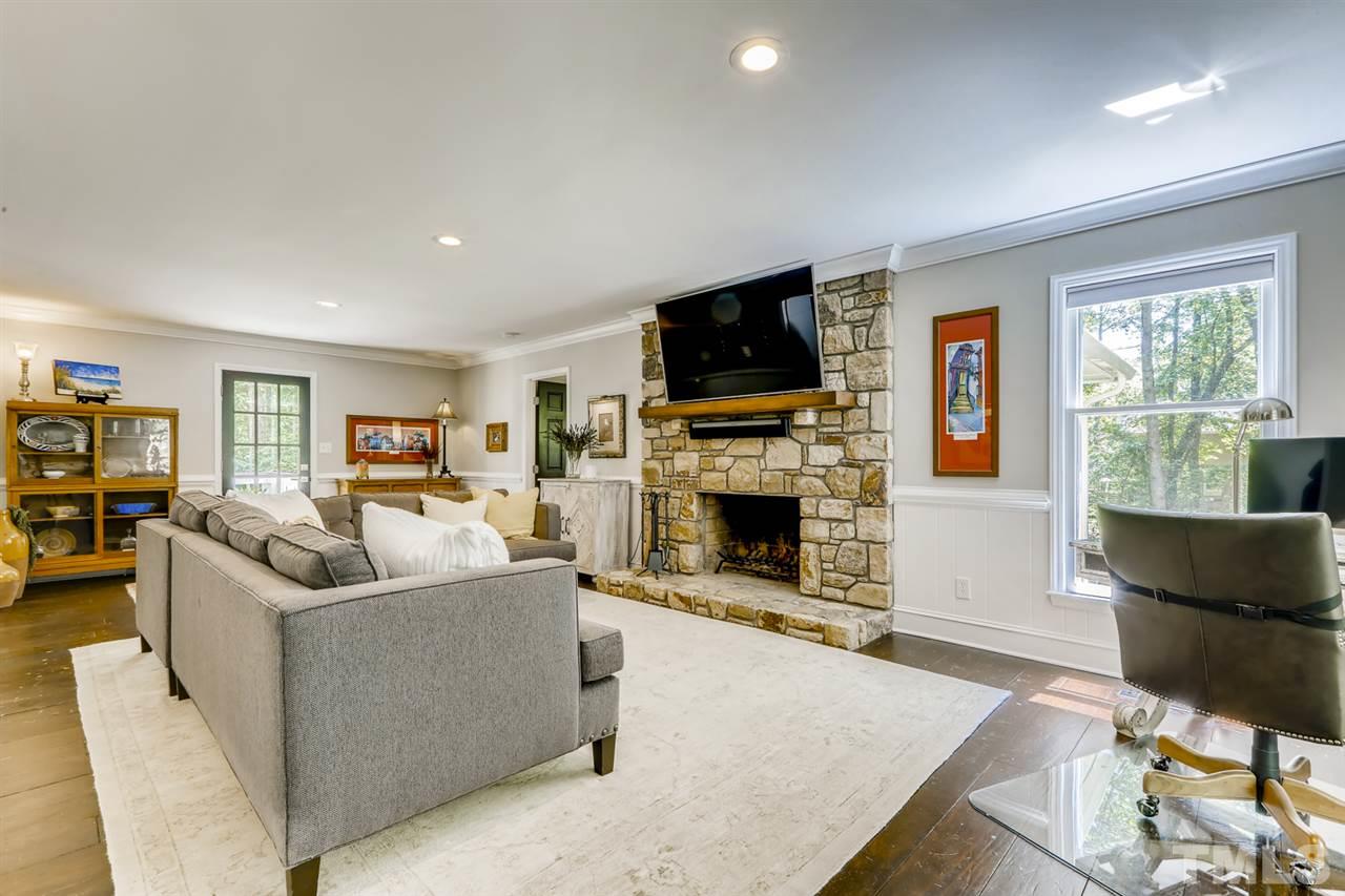 3501 Campbell Road Raleigh, NC 27606 - Photo 7 of 30 Large family room with stone, wood burning fireplace with gas starter