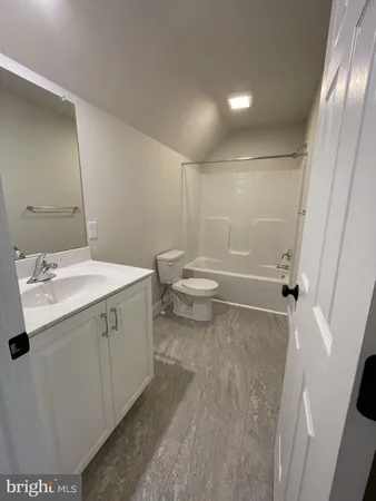 a view of a bathroom with a sink and mirror