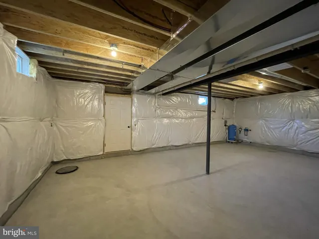 a view of dirt yard with a large tree