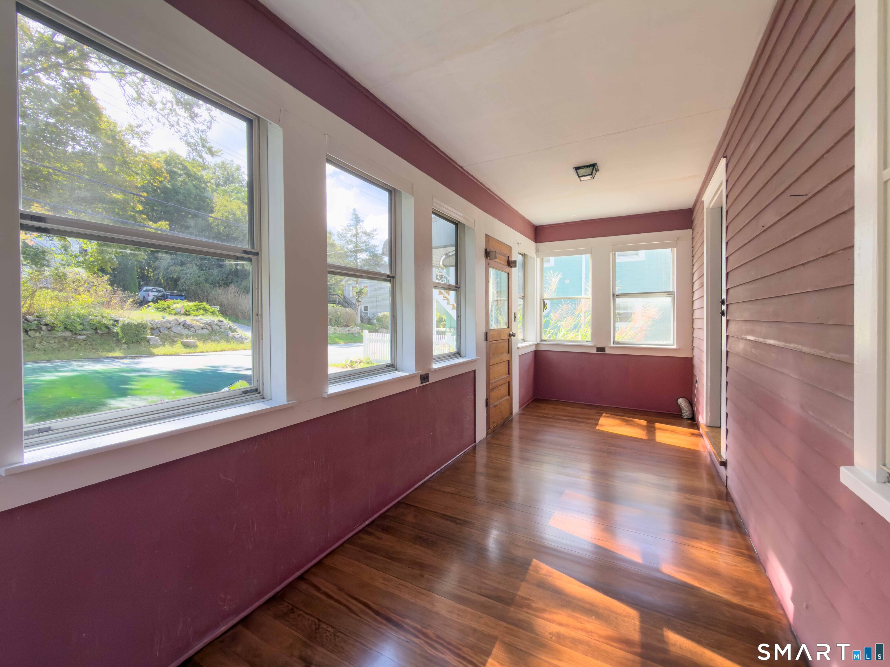 72 Roosevelt Avenue Norwich, CT 06360 - Photo 19 of 24 Enclosed front porch with dryer hookup.