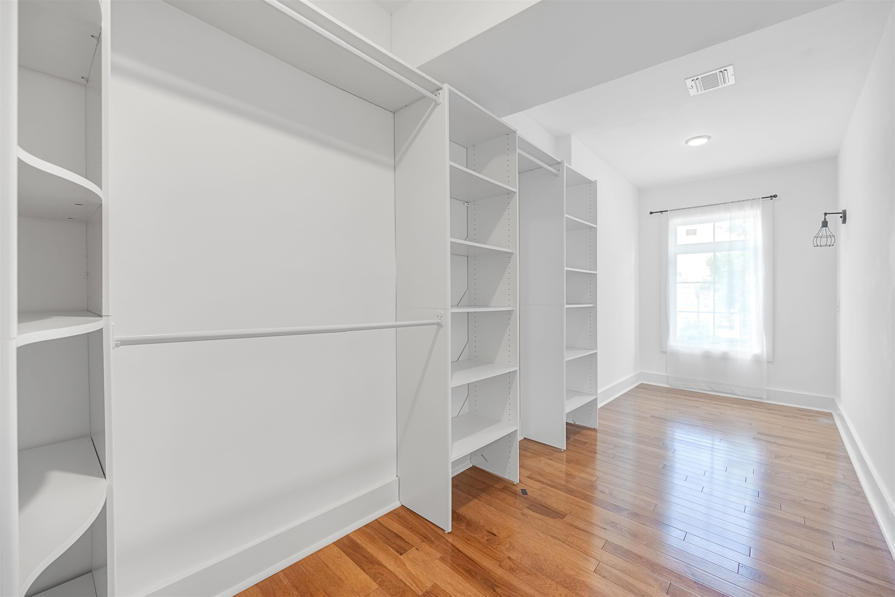 107 Mountain Road Jersey City, NJ 07307 - Photo 21 of 41 a view of walk in closet with empty racks
