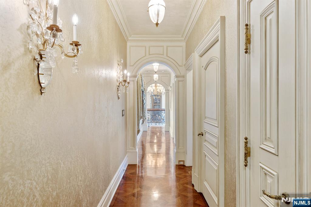 78 Roberts Road Englewood Cliffs, NJ 07632 - Photo 28 of 50 a view of a hallway with wooden floor and staircase