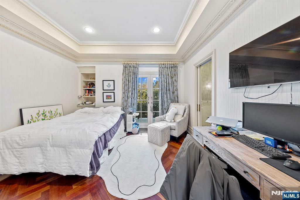78 Roberts Road Englewood Cliffs, NJ 07632 - Photo 33 of 50 a bed room with a bed tv and a window