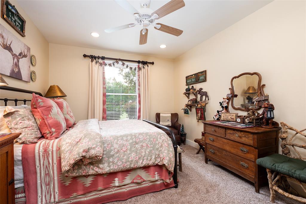 2312 Cactus Rio Lane Weatherford, TX 76087 - Photo 22 of 37 a bedroom with a bed and wooden furniture