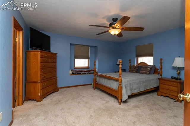 a bathroom with a tub and a window