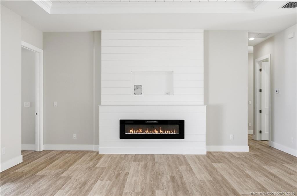 1063 Northwest 12th Terrace Stuart, FL 34994 - Photo 14 of 42 a room with a fireplace