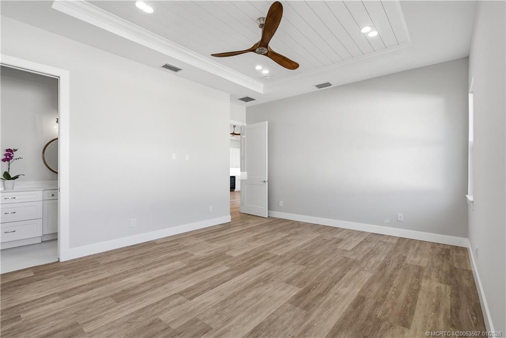 1063 Northwest 12th Terrace Stuart, FL 34994 - Photo 25 of 42 wooden floor in an empty room