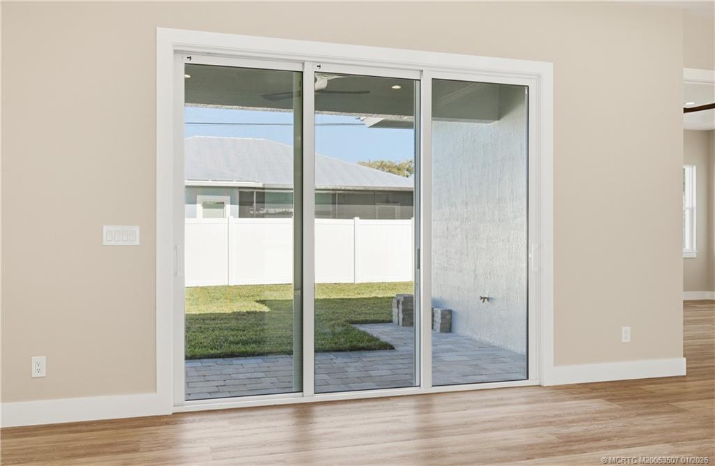 1063 Northwest 12th Terrace Stuart, FL 34994 - Photo 36 of 42 a view of a glass door of the house