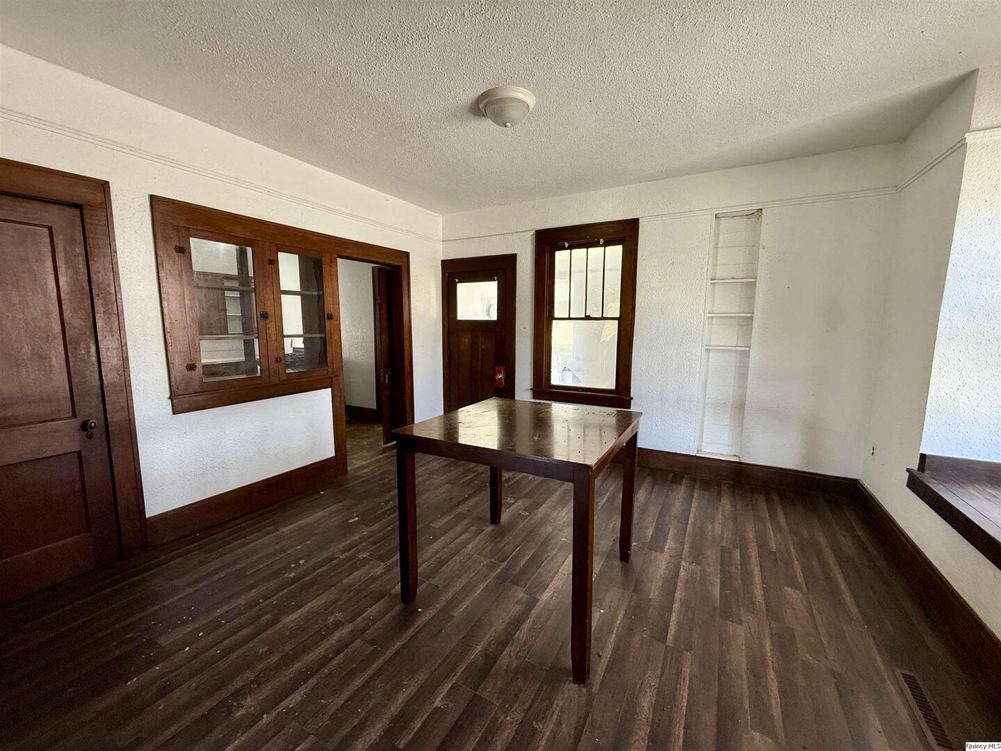 622 East Center Street Loraine, IL 62349 - Photo 11 of 21 a view of a room with wooden floor electronic appliances and windows