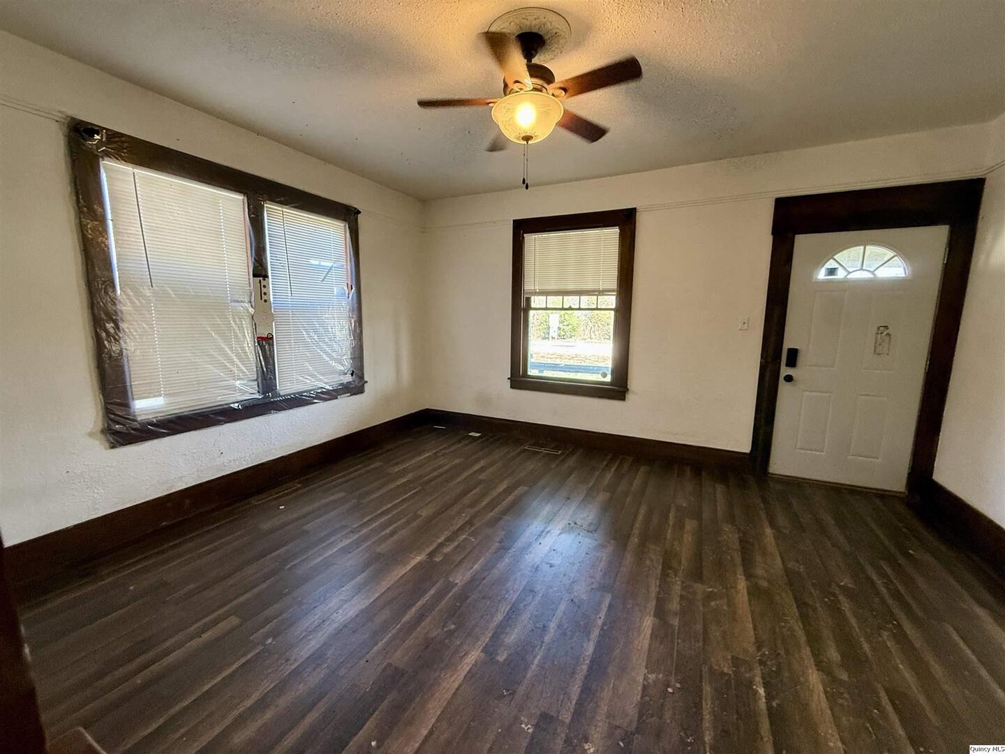 622 East Center Street Loraine, IL 62349 - Photo 12 of 21 a view of an empty room with wooden floor and a window
