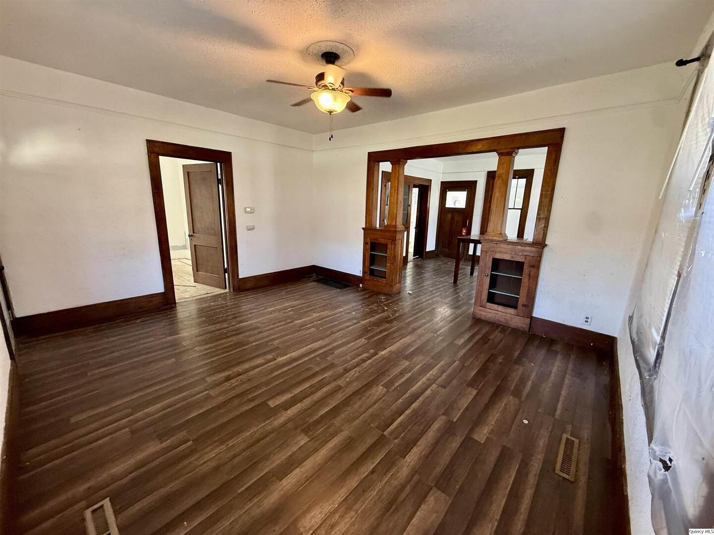 622 East Center Street Loraine, IL 62349 - Photo 13 of 21 wooden floor in an empty room with a window