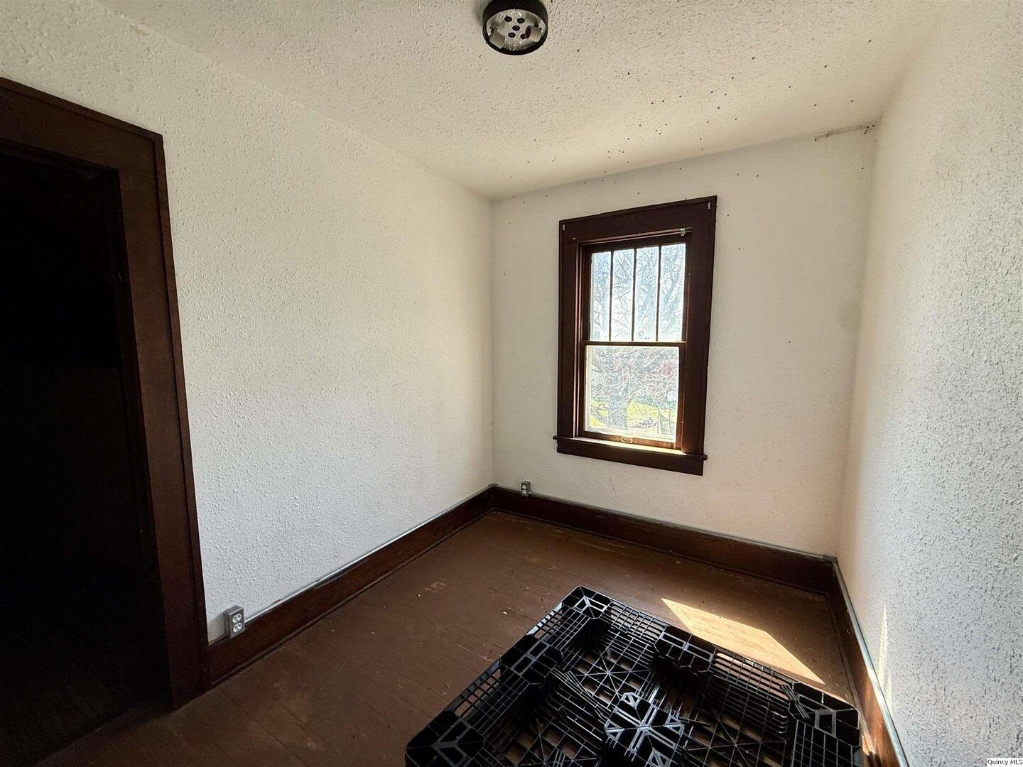 622 East Center Street Loraine, IL 62349 - Photo 18 of 21 an empty room with windows