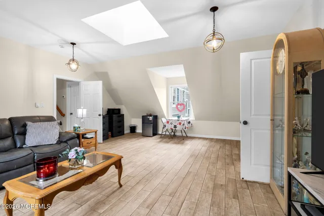a white toilet sitting next to a shower