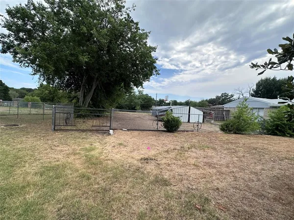 a backyard of a house with lots of green space
