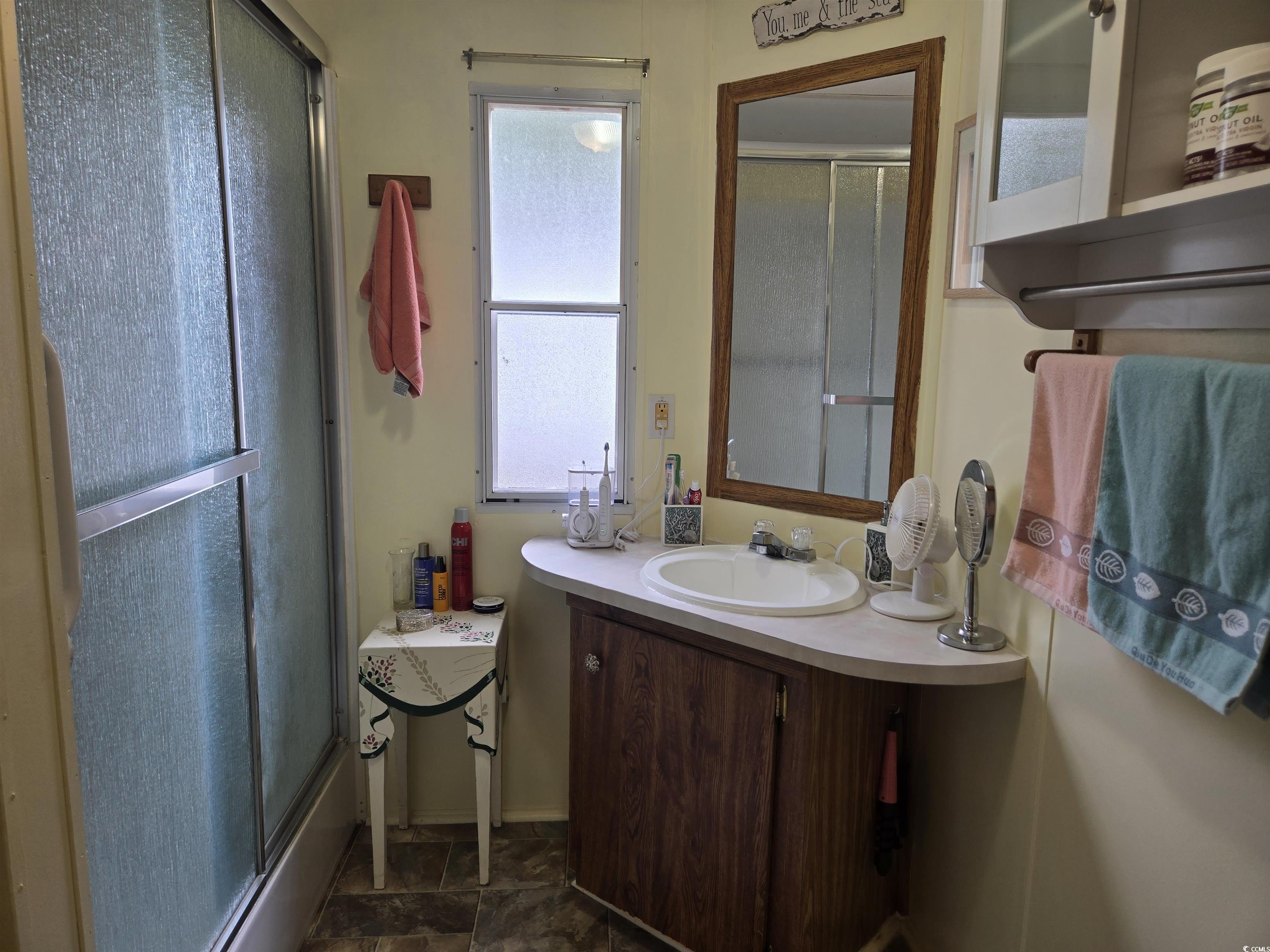 348 Bridge Street Murrells Inlet, SC 29576 - Photo 24 of 28 Bathroom featuring vanity and stone finish floors