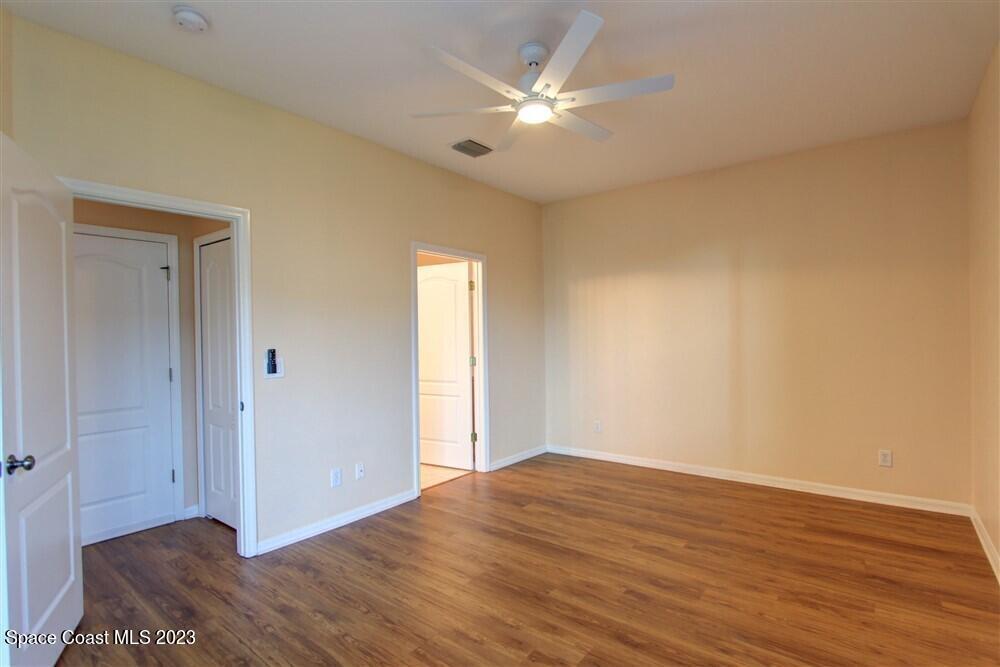 264 Intrepid Way Indialantic, FL 32903 - Photo 17 of 36 a view of an empty room with wooden floor