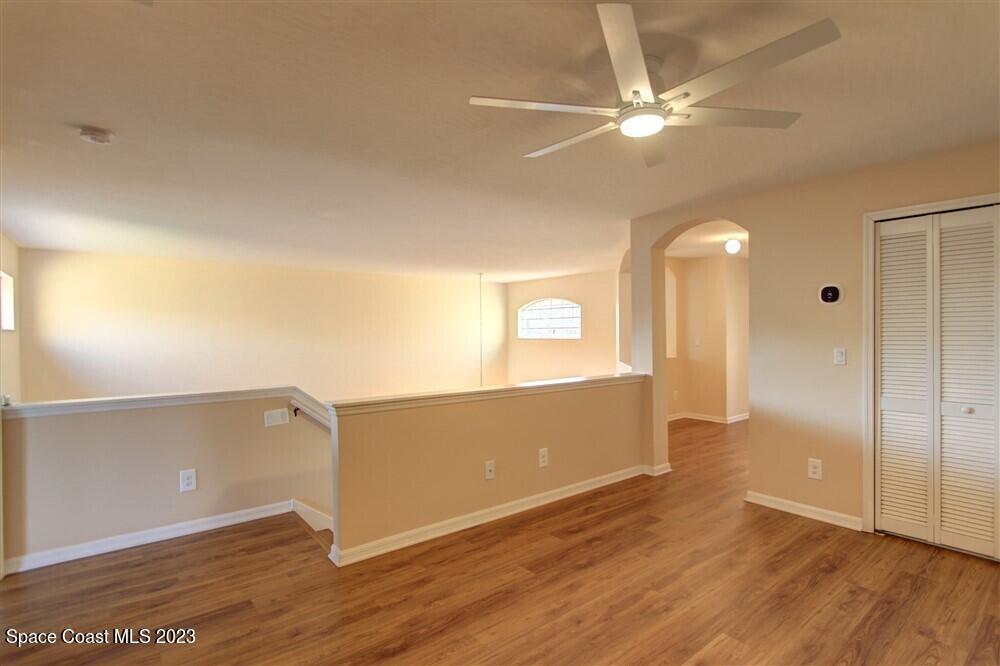 264 Intrepid Way Indialantic, FL 32903 - Photo 19 of 36 a view of a livingroom with wooden floor and cabinet