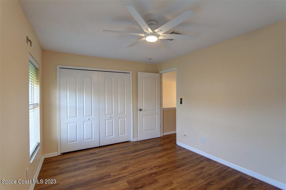 264 Intrepid Way Indialantic, FL 32903 - Photo 21 of 36 a view of an empty room with wooden floor