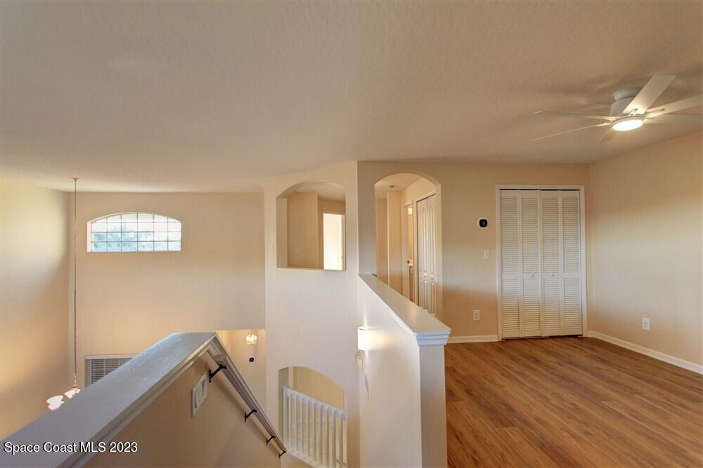 264 Intrepid Way Indialantic, FL 32903 - Photo 22 of 36 a view of hallway with wooden floor