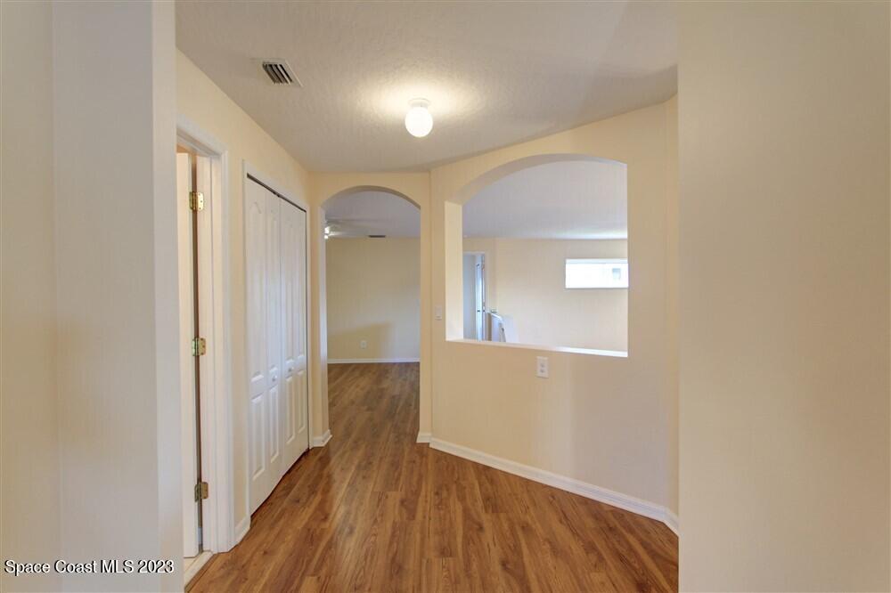 264 Intrepid Way Indialantic, FL 32903 - Photo 29 of 36 a view of hallway with wooden floor