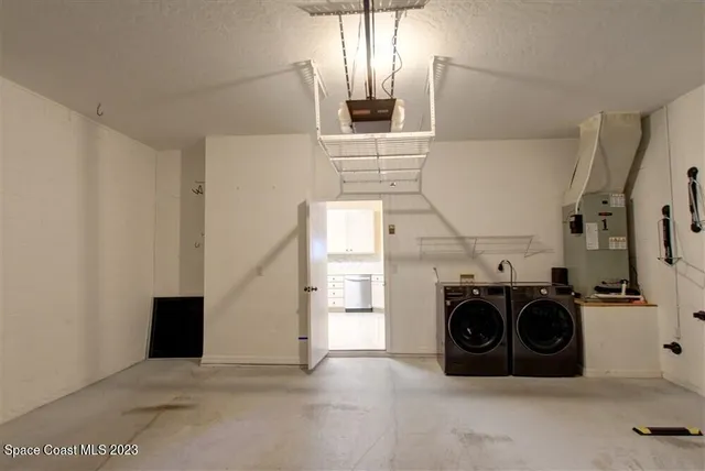 a utility room with dryer and washer