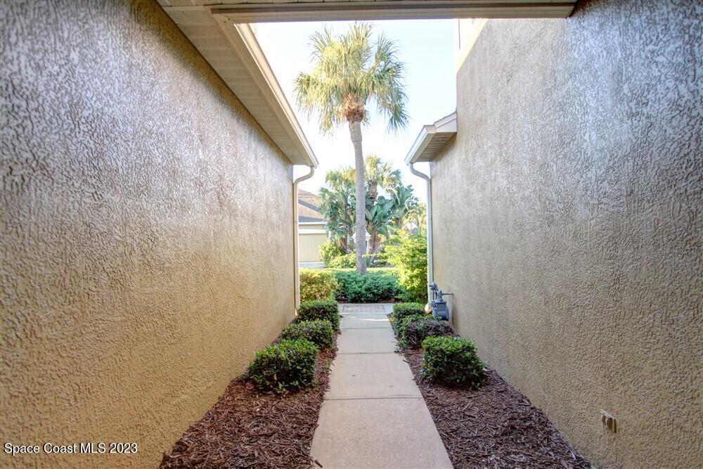 264 Intrepid Way Indialantic, FL 32903 - Photo 35 of 36 a view of a pathway with a flower pot