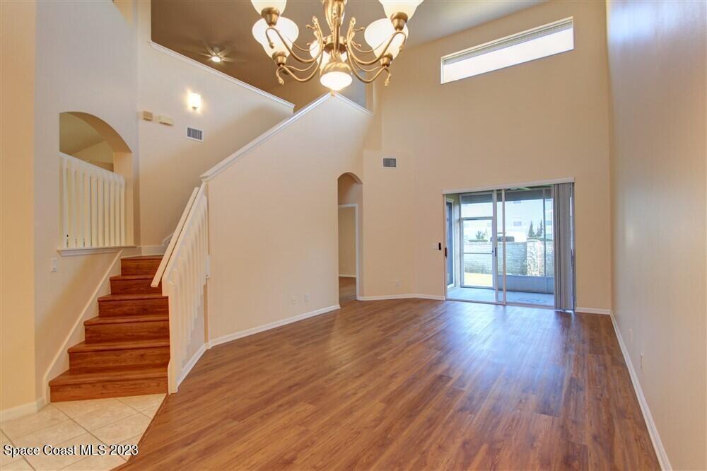 264 Intrepid Way Indialantic, FL 32903 - Photo 8 of 36 a view of an entryway with wooden floor