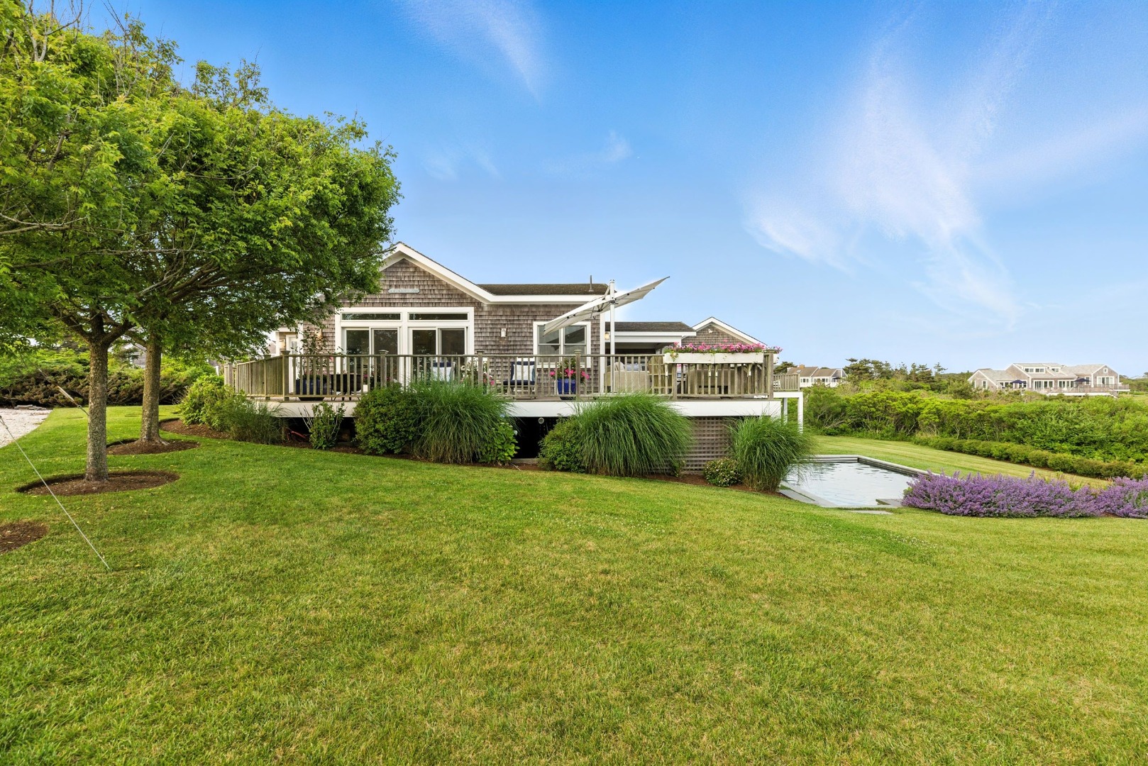 45 Starbuck Road Nantucket, MA 02554 - Photo 3 of 42 a front view of a house with a yard