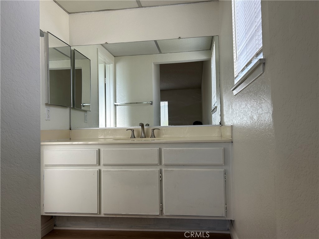 7221 Daybreak Place Rancho Cucamonga, CA 91701 - Photo 19 of 24 a bathroom with a sink and a mirror