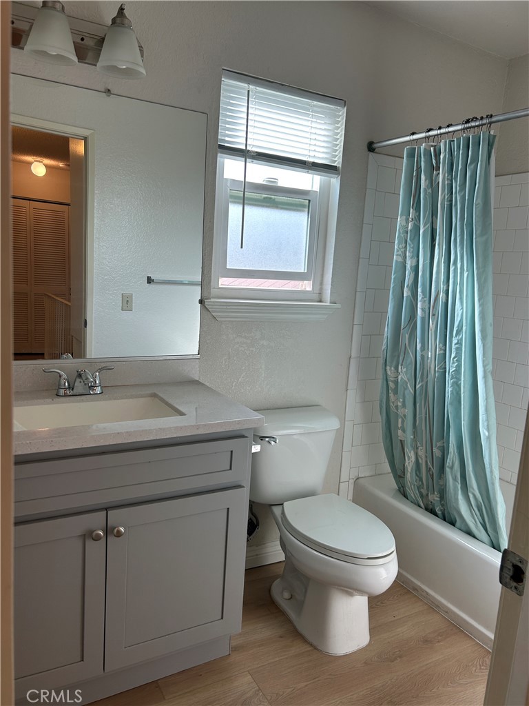 7221 Daybreak Place Rancho Cucamonga, CA 91701 - Photo 21 of 24 a bathroom with a toilet a sink and a mirror