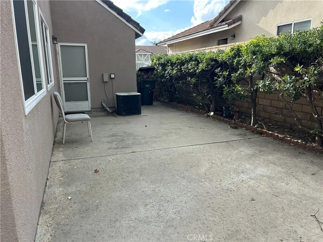 a backyard of a house with plants