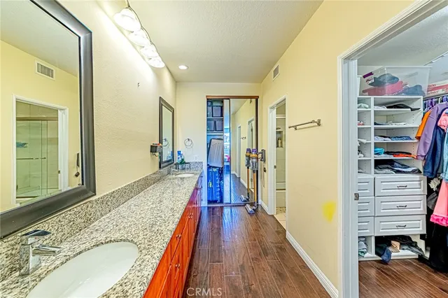 a view of a hallway view with wooden floor and staircase