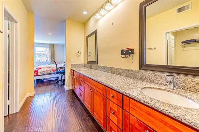 a en suite bathroom with sink and mirror