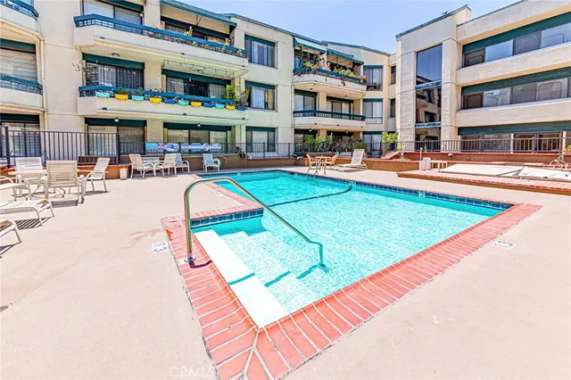 a view of a chairs and table in a patio